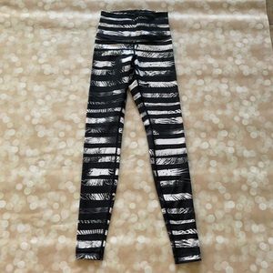 Black and White Striped Lululemon Pants with Palm Detail.
